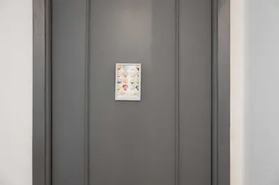 a door with a picture of donuts on it at Habitación en Apartamento Teo in Santiago de Compostela