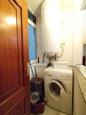 a laundry room with a washing machine in it at Con Encanto en la Playa in Viveiro