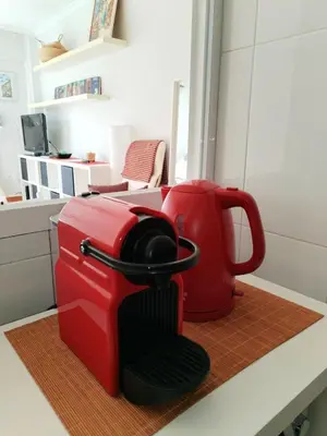 a red coffee maker sitting on a counter at Con Encanto en la Playa in Viveiro