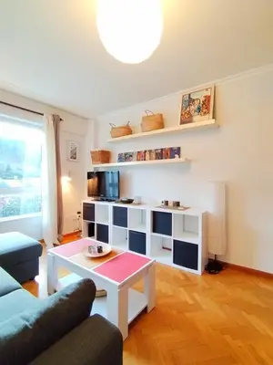 a living room with a couch and a table at Con Encanto en la Playa in Viveiro
