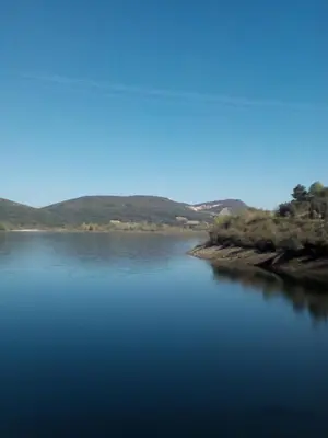 a large body of water with mountains in the background at Casa Rural El Cabo in Carucedo
