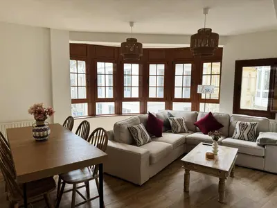 a living room with a couch and a table at Las Cuatro Calles in Ribadeo