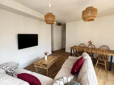 a living room with a couch and a table at Las Cuatro Calles in Ribadeo
