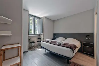 a bedroom with a large bed in a room at Kumano Kodo by Como en Casa in Santiago de Compostela
