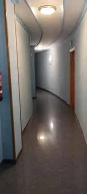 an empty room with a hallway with a door and a hallwayngth at Apartamento Los Gallegos in Foz