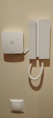 a phone hanging on a wall in a room at Piso Altos de Foz in Foz