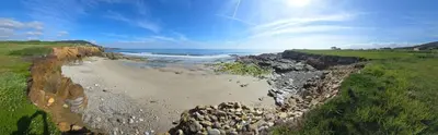 an aerial view of a rocky beach with the ocean at Piso Altos de Foz in Foz