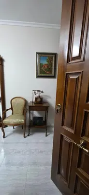 a room with a door and a chair and a table at Amma Ribeira Sacra in Monforte de Lemos