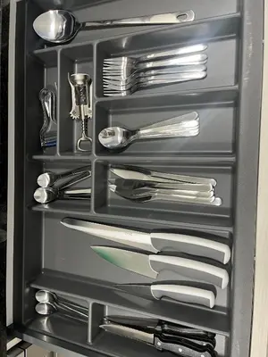 a drawer full of utensils in a refrigerator at Vistas del Parque in Santiago de Compostela