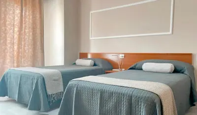 two beds sitting next to each other in a room at Casa Pazos, Pedrafita do Cebreiro in Piedrafita