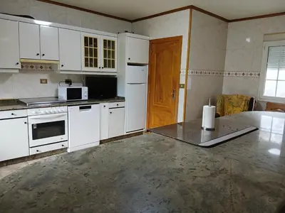 a bathroom with a shower and a toilet and a green towel at Casa Pucho Castroverde in Barreiros