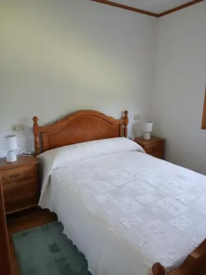 a kitchen with white cabinets and a sink and a window at Casa Pucho Castroverde in Barreiros
