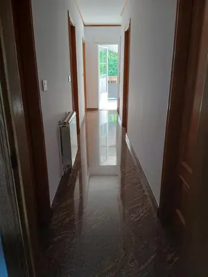 a stairwell with a wooden railing and a window at Casa Pucho Castroverde in Barreiros