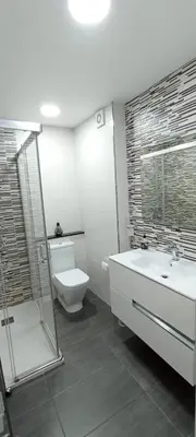 a bathroom with a toilet and a sink and a shower at EnSAN CIPRIAN Con Vistas Al Mar in Cervo