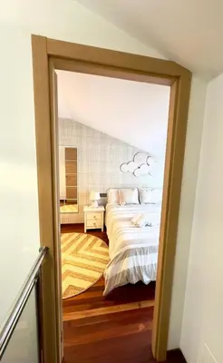 a bedroom with a bed with clouds in the ceiling at Viorneira in Milladoiro
