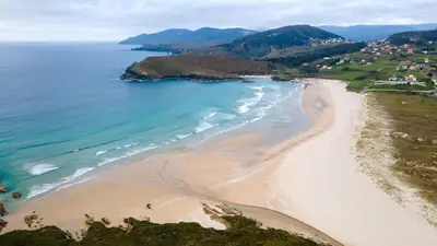 an aerial view of a beach and the ocean at Casa Fonfría in Cabañas