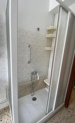 a shower with a glass door in a bathroom at Casa Fonfría in Cabañas