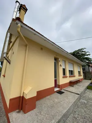 a building with a pipe on the side of it at Casa Fonfría in Cabañas