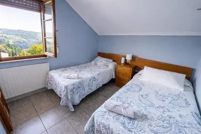 an overhead view of a wooden staircase with a window at Casa Rural Nito - Naturaleza y Descanso en Asturias in Villayón