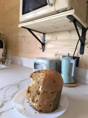 a loaf of bread on a plate on a counter at Cabaña de madera Mar y Madera, playa de las catedrales in Barreiros