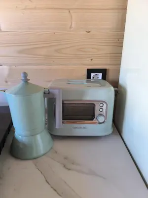 a toaster sitting on a counter next to a blender at Cabaña de madera Mar y Madera, playa de las catedrales in Barreiros
