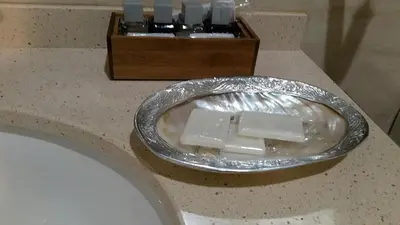 a bathroom counter with a sink and a box of soap at Casa De Aldea La Galea in Vegadeo