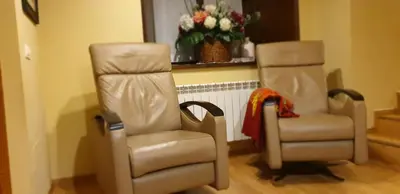 two chairs sitting next to each other in a room at Casa De Aldea La Galea in Vegadeo