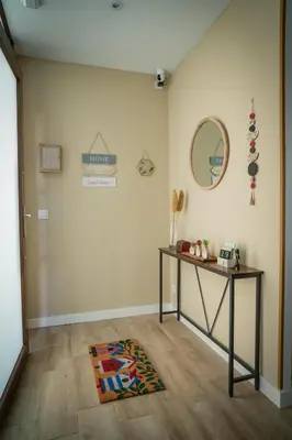 a room with a table and a mirror on the wall at A Torna in Palas de Rei