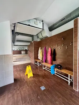 a gym with wooden walls and benches in a room at Costa Reinante Spa in San Miguel de Reinante