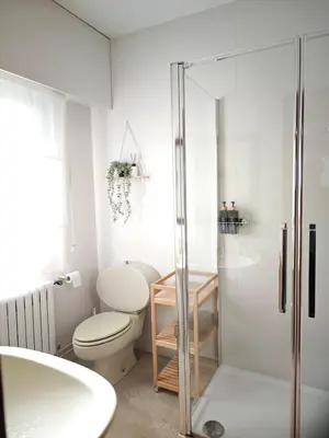 a bathroom with a toilet and a glass shower at O Retiro de Bernardo in Teo