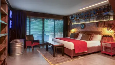 a bedroom with a large bed in a room at Glam Taoo Hotel Apartamento Boutique in Lugo