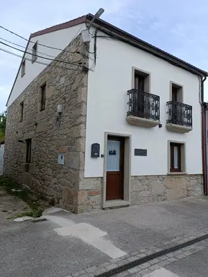 a house with a patio in front of it at A Casa da aldea de Iria in Padrón