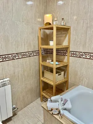 a bathroom with a sink and a bath tub at Ático las Palmeras in Caldas de Reis