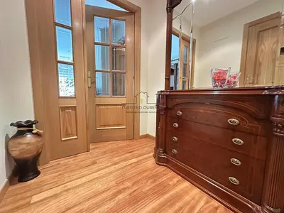 a room with a dresser and a large mirror at Parque Ávila in Ourense