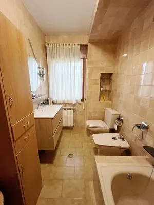 a bathroom with a sink and a toilet and a tub at Casa María in Santa Eulalia