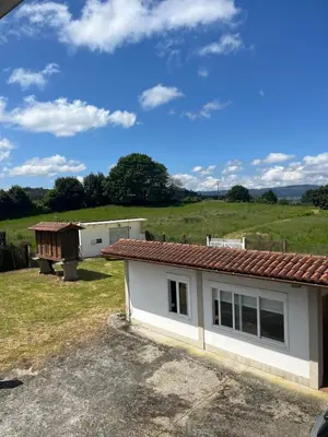 a house with a small shed next to a yard at Casa María B in Santa Eulalia