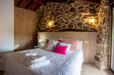 a bedroom with a large bed with towels on it at Villa Limia