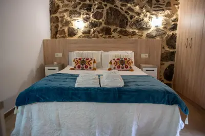 a bedroom with a bed with towels on it at Villa Limia