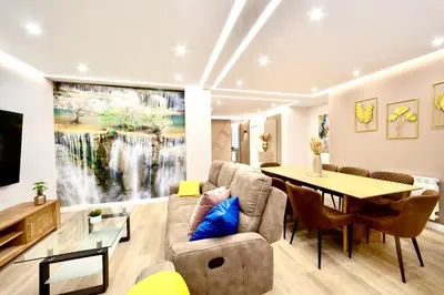 a living room with a couch and a table at Urban Essences by Lugo Collection in Lugo