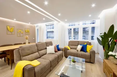 a living room with a couch and a table at Urban Essences by Lugo Collection in Lugo