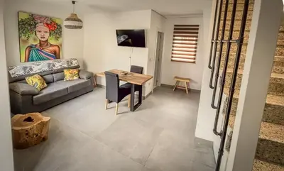 a living room with a couch and a table at Casa de Conxo in Santiago de Compostela