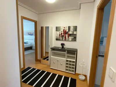 a small room with a black and white rug at EnBURELA Playa in Burela de Cabo
