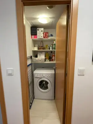 a washer and dryer in a small room at EnBURELA Playa in Burela de Cabo