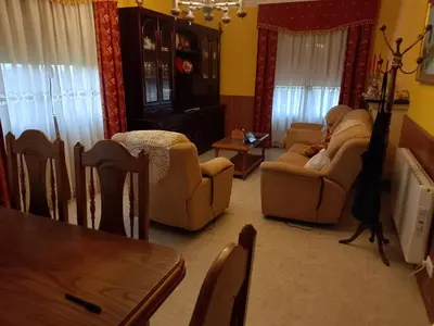 a living room with two couches and a table at Casa Las Catedrales Rochela in Devesa