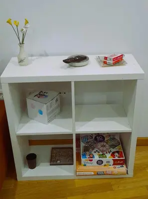 a white shelf with a table and a box at EnFOZ Tus Mejores Vacaciones, Playa Piscina y Parking in Foz