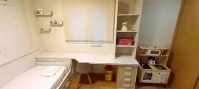 a small room with a bed and a desk at EnFOZ Tus Mejores Vacaciones, Playa Piscina y Parking in Foz