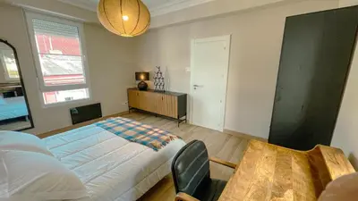 a bedroom with a bed and a table in it at Jackson 3 in Lugo
