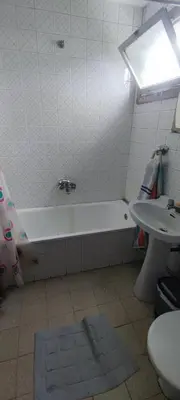 a bathroom with a bath tub and a sink at Rosalia Rooms in A Estrada