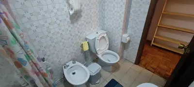 a bathroom with a toilet and a bidet at Rosalia Rooms in A Estrada