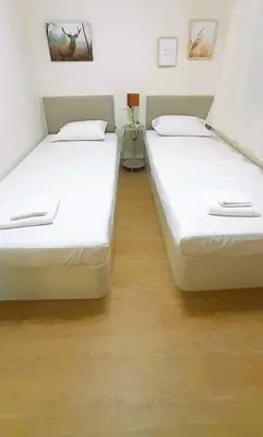 two beds sitting next to each other in a room at EnFOZ Playa A Rapadoira in Foz